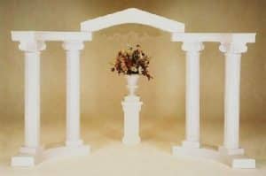 white colonnade wedding arch