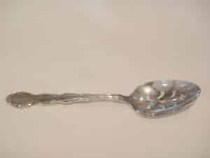 silver slotted serving spoon