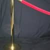 brass stanchion and red velvet roping